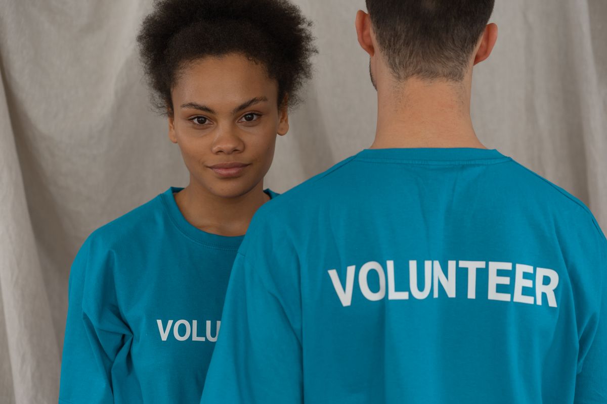 A volunteer wearing a charity t-shirt